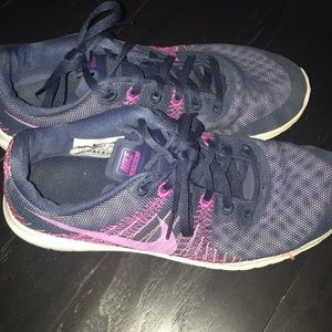 Gently used navy and purple nike running shoes